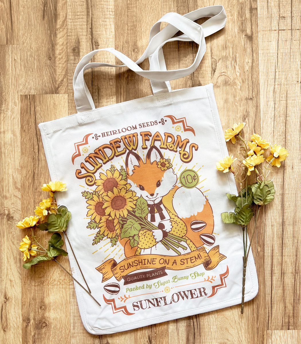 http://www.sugarbunnyshop.com/cdn/shop/files/sundew-farms-sunflower-fox-canvas-tote-bag.jpg?v=1684439824