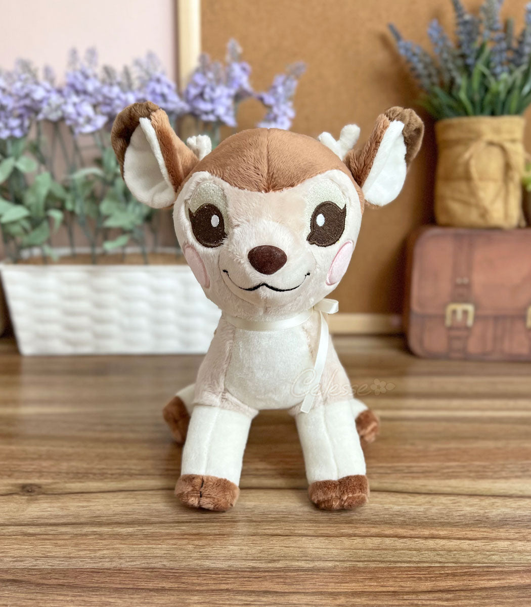 Cinnafawn Deer Plush sitting and facing the camera