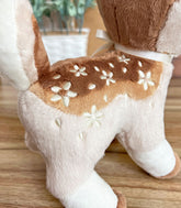 Cinnafawn Deer Plush close up shot of embroidered flower details