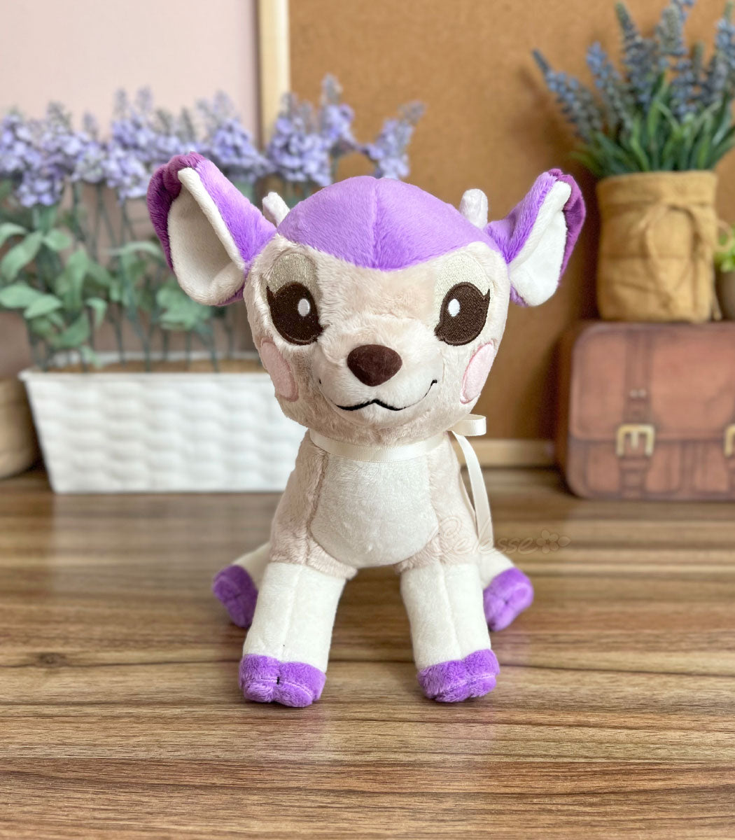 Lavendeer Fawn Plush sitting facing the camera